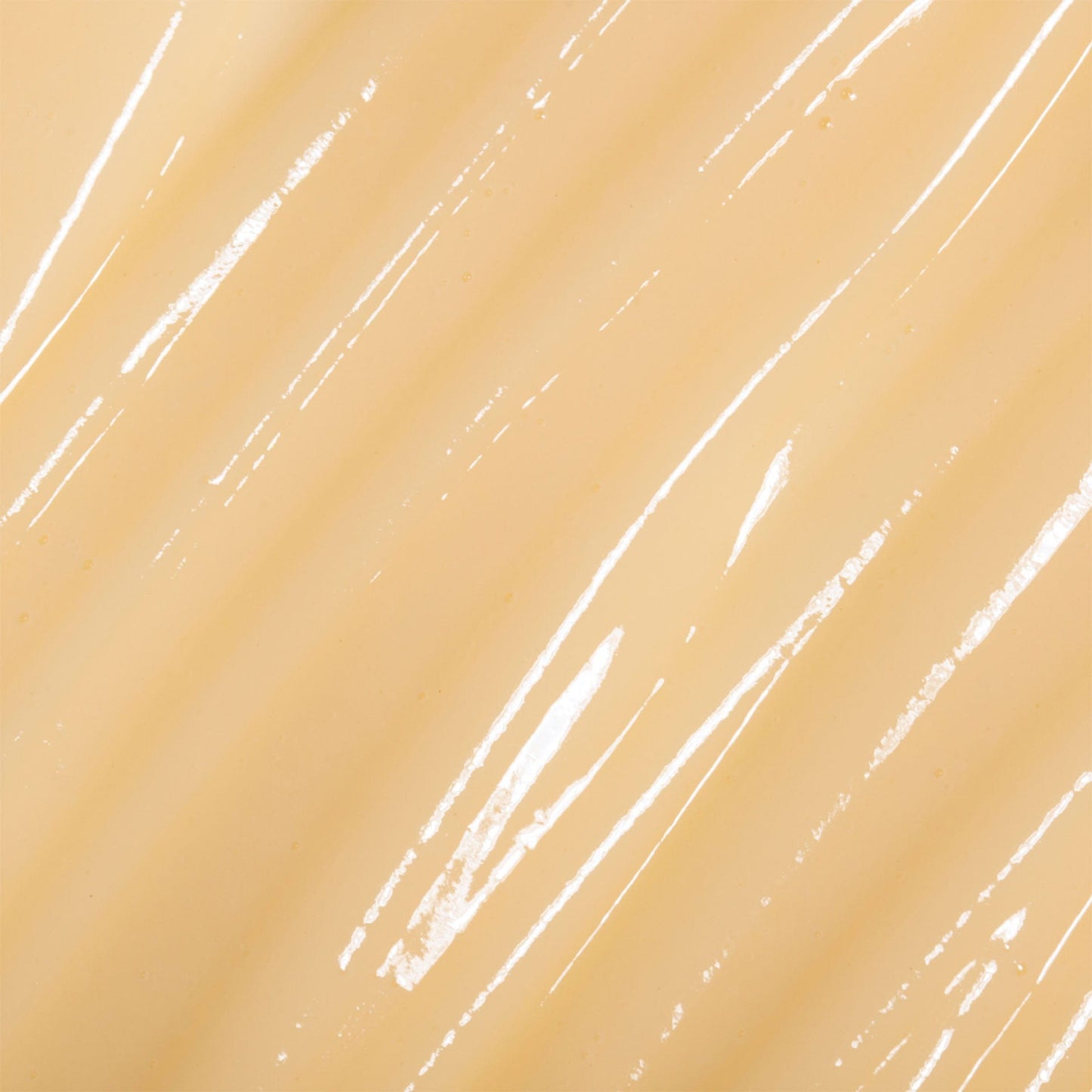 Close-up of beige citrus cleanser swatch with white streaks