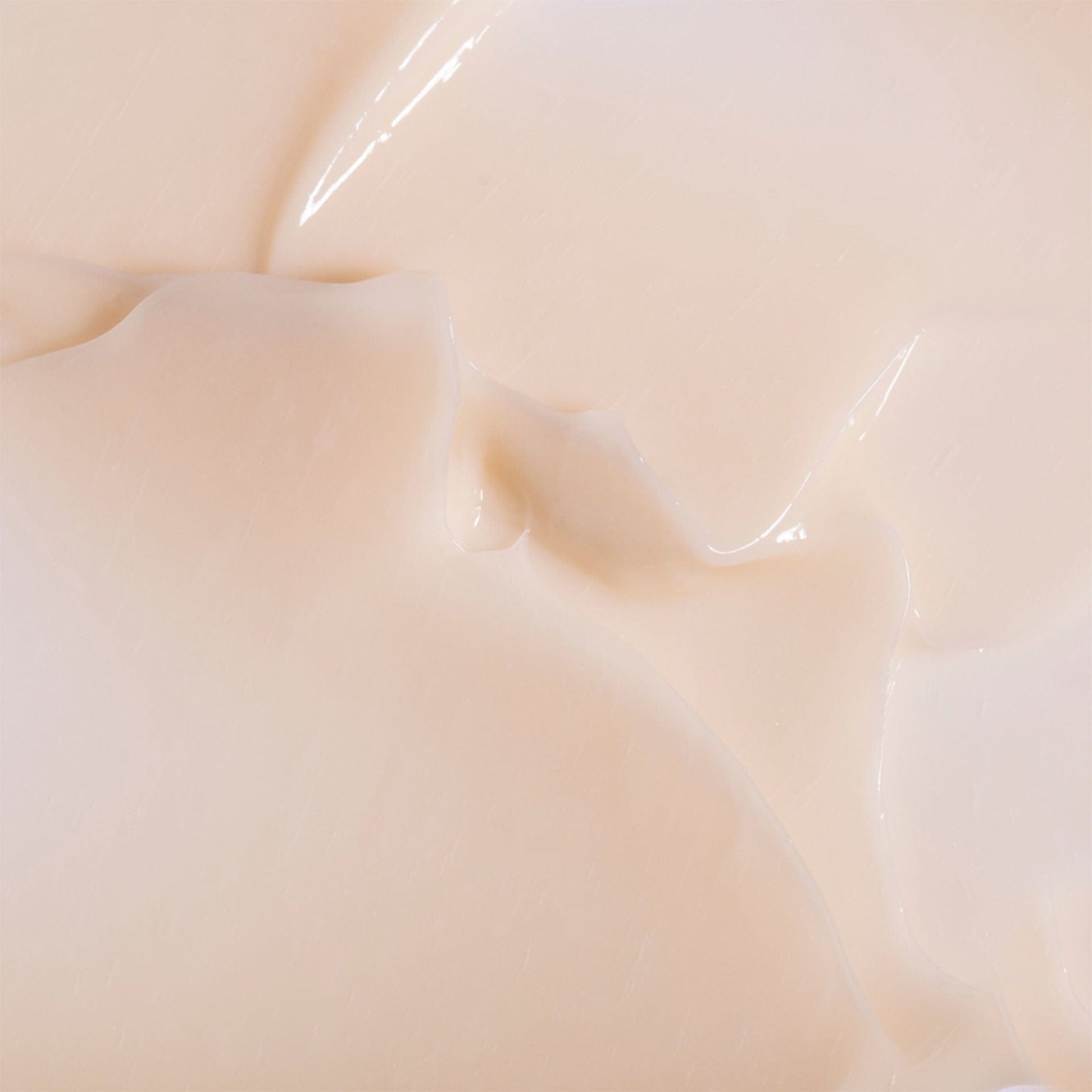 Close-up of smooth, beige-colored light moisturiser swatch