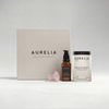 Aurelia skincare products including a box, Absolute Beauty, The Probiotic Concentrate and Gua Sha on a light background