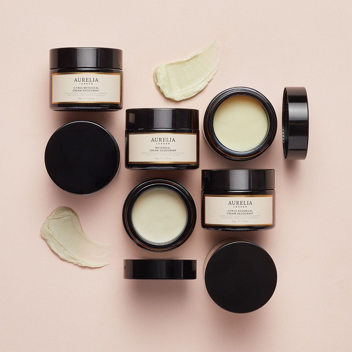 Aurelia botanical cream deodorants on a pink background