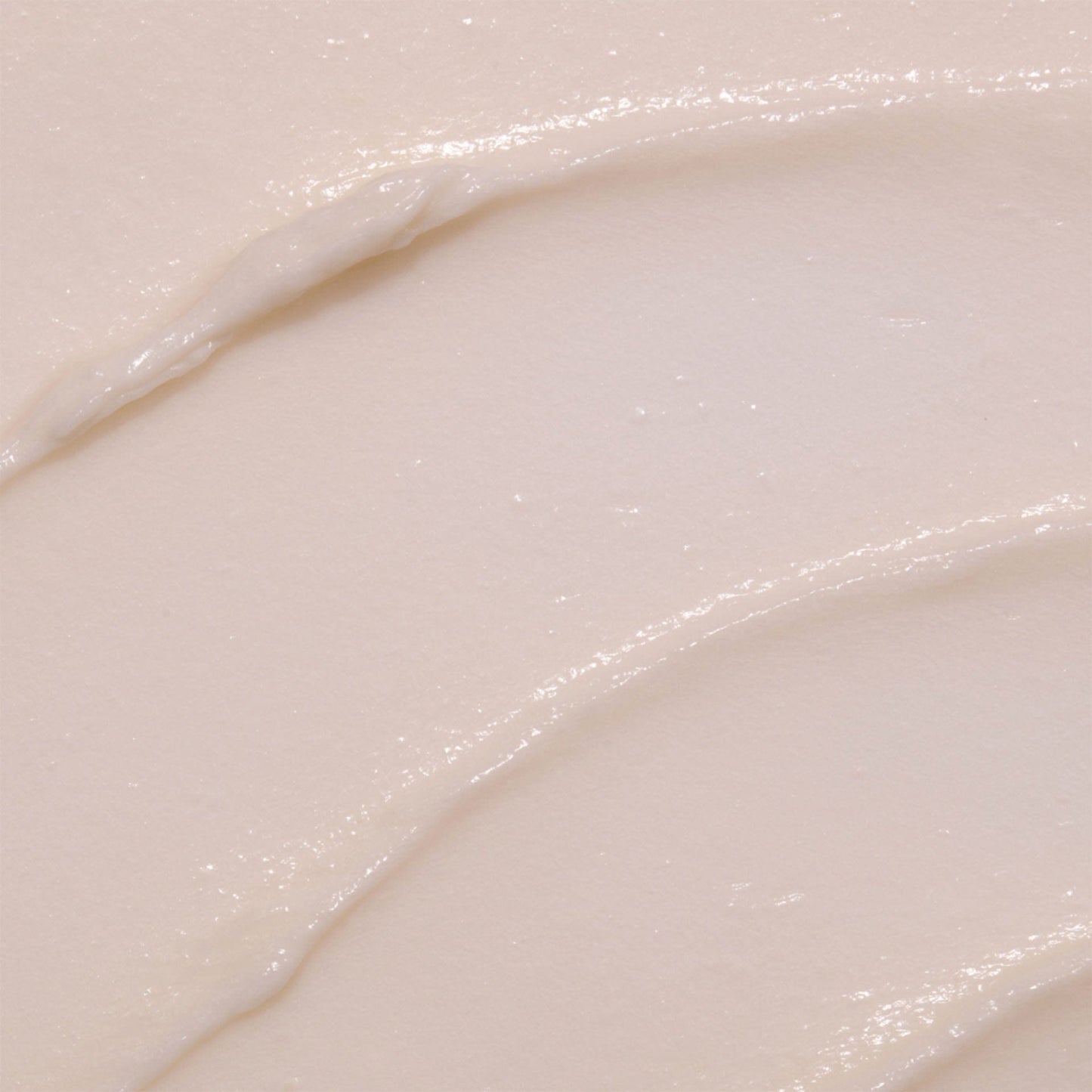 Close-up of a smooth, light-colored cell revitalise day moisturister with subtle texture