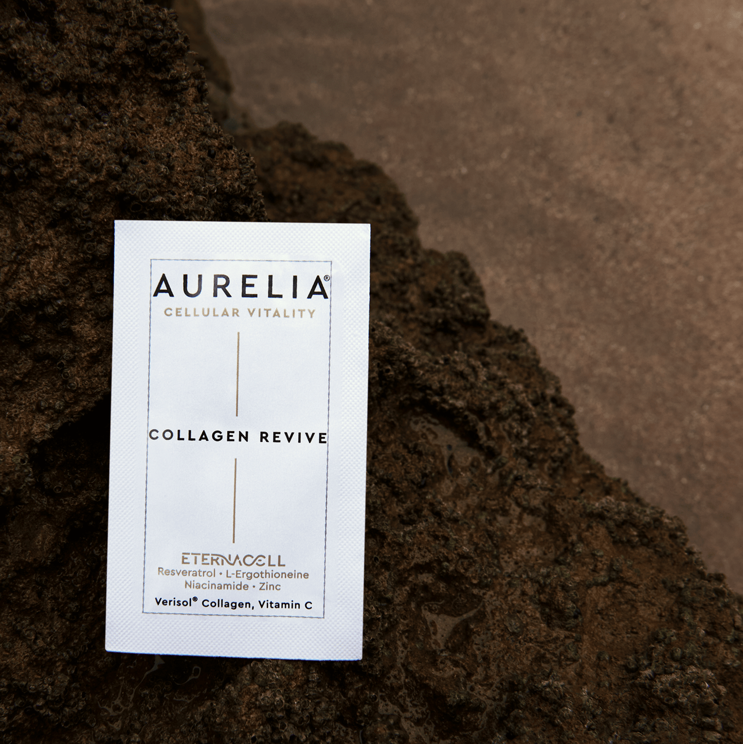 Aurelia Collagen Revive product packaging on a textured brown surface