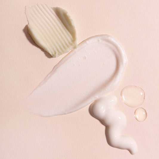 White skincare swatches on a pink background