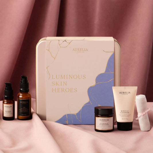 Aurelia skincare product set with a decorative box on a pink fabric background