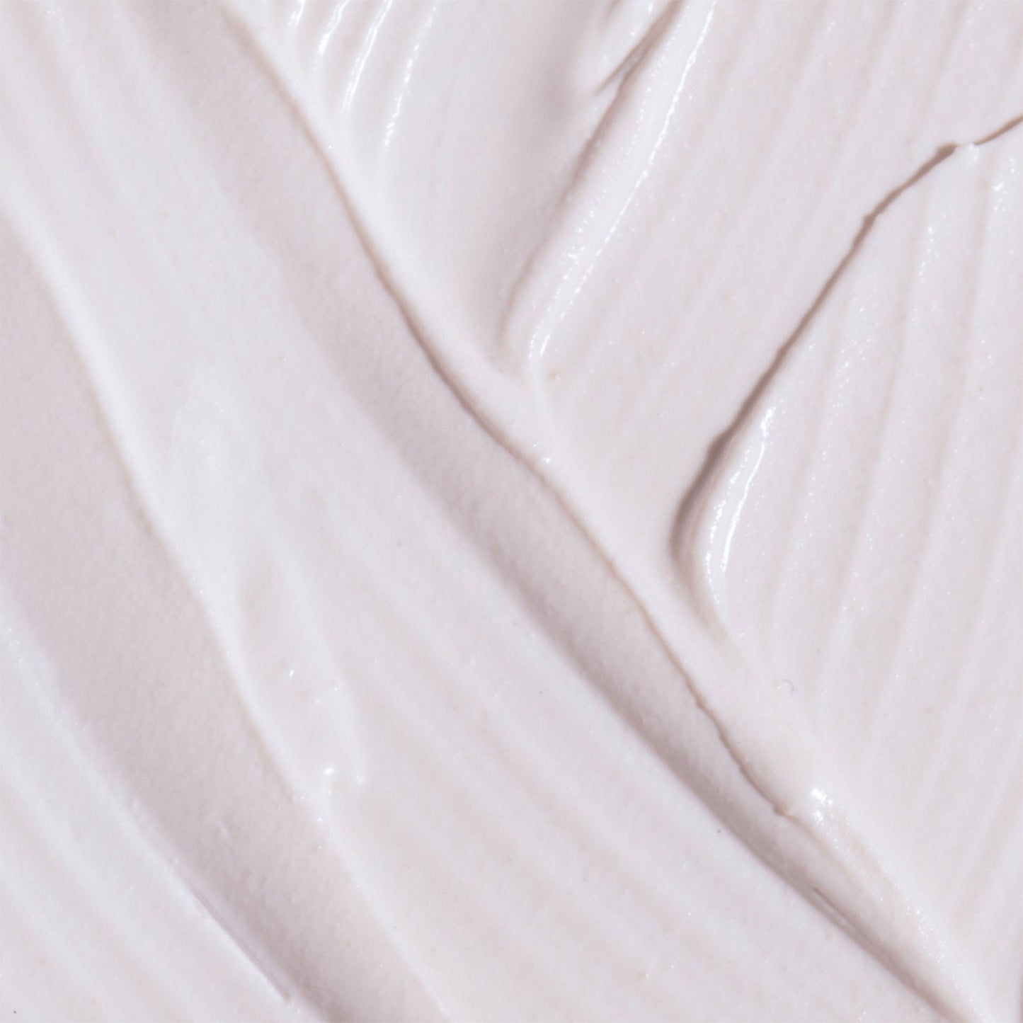 Close-up of a smooth, light pink probiotic blemish hero with subtle texture