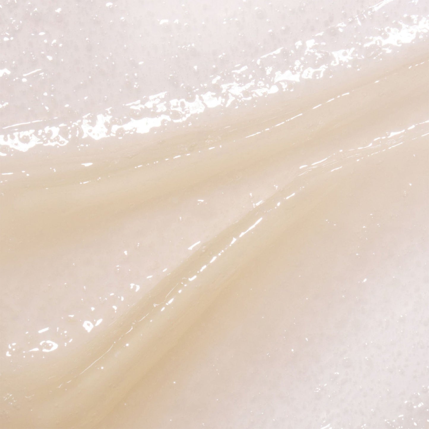 Close-up of a white exfoliation mask with a subtle pattern