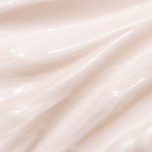 Close-up of smooth, light pink cream body wash