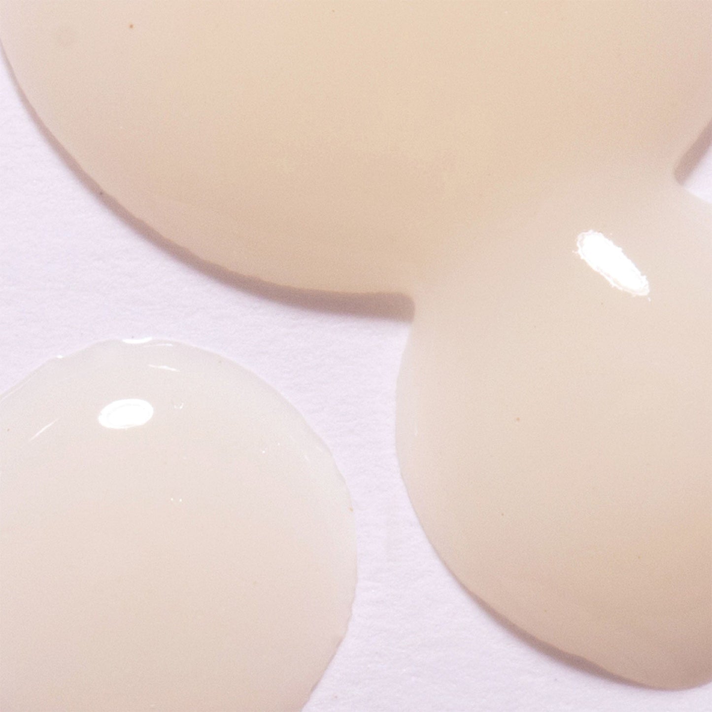 Close-up of beige probiotic concentrate on a white background