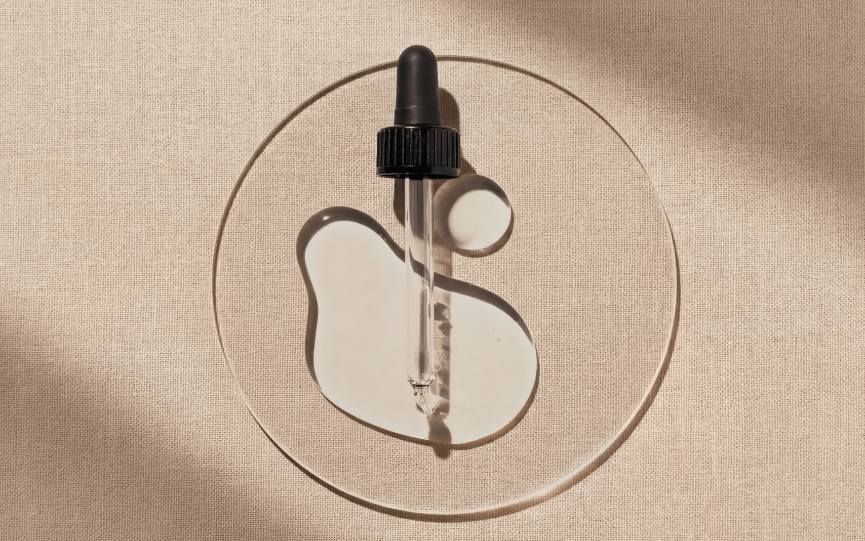 Black dropper beige background