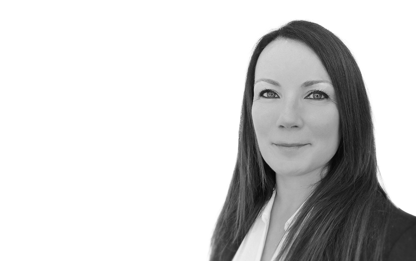 Black and white portrait of a woman with long hair on a white background