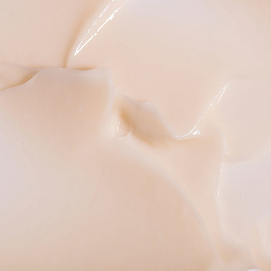 Close-up of smooth, beige-colored light moisturiser swatch
