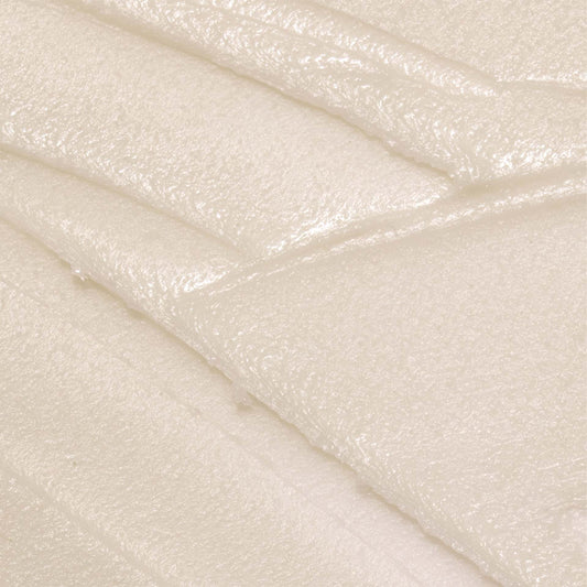 Close-up of textured white cream deodorant with a subtle pattern