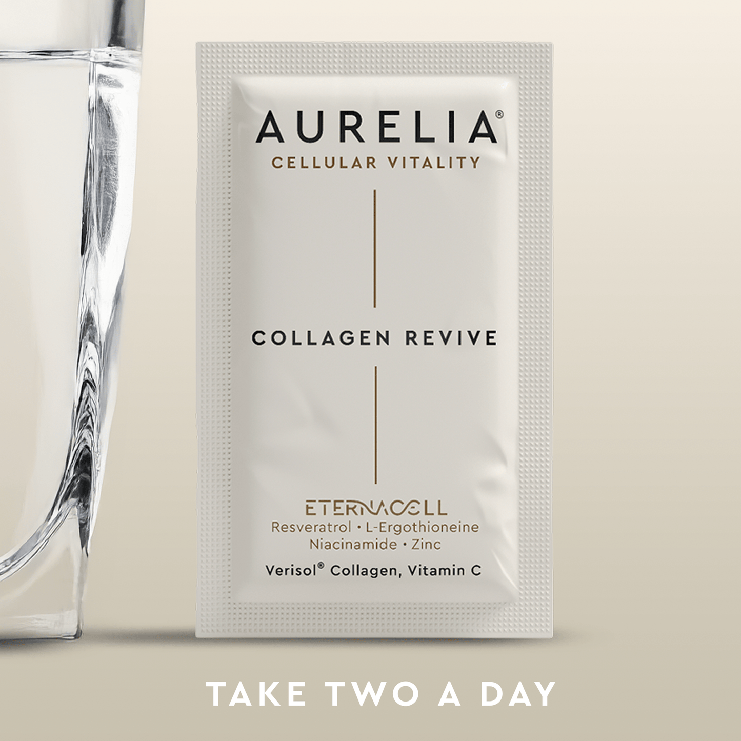 Aurelia Collagen Revive package with a glass of water on a beige background