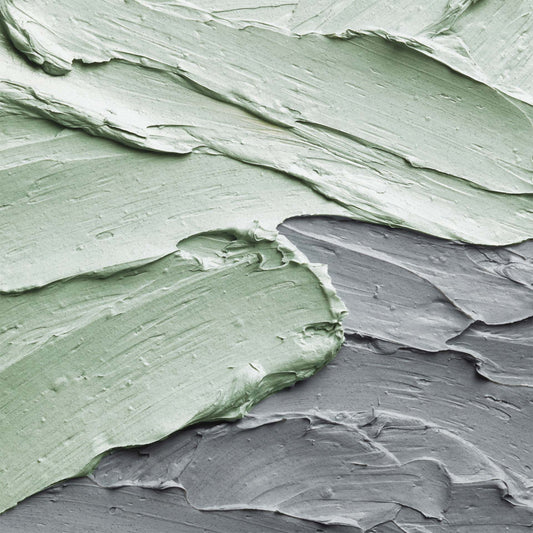 Close-up of green and gray textured clay mask 